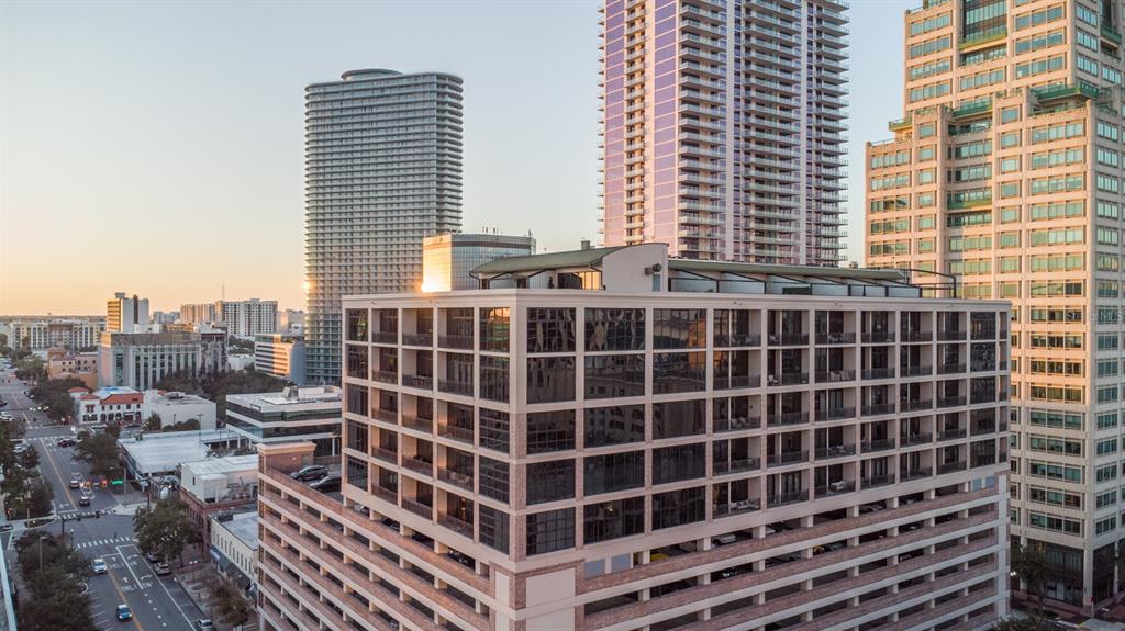An aerial view of a multi-story residential building with a parking garage base — 175 2ND STREET S UNIT 808, ST PETERSBURG, FL