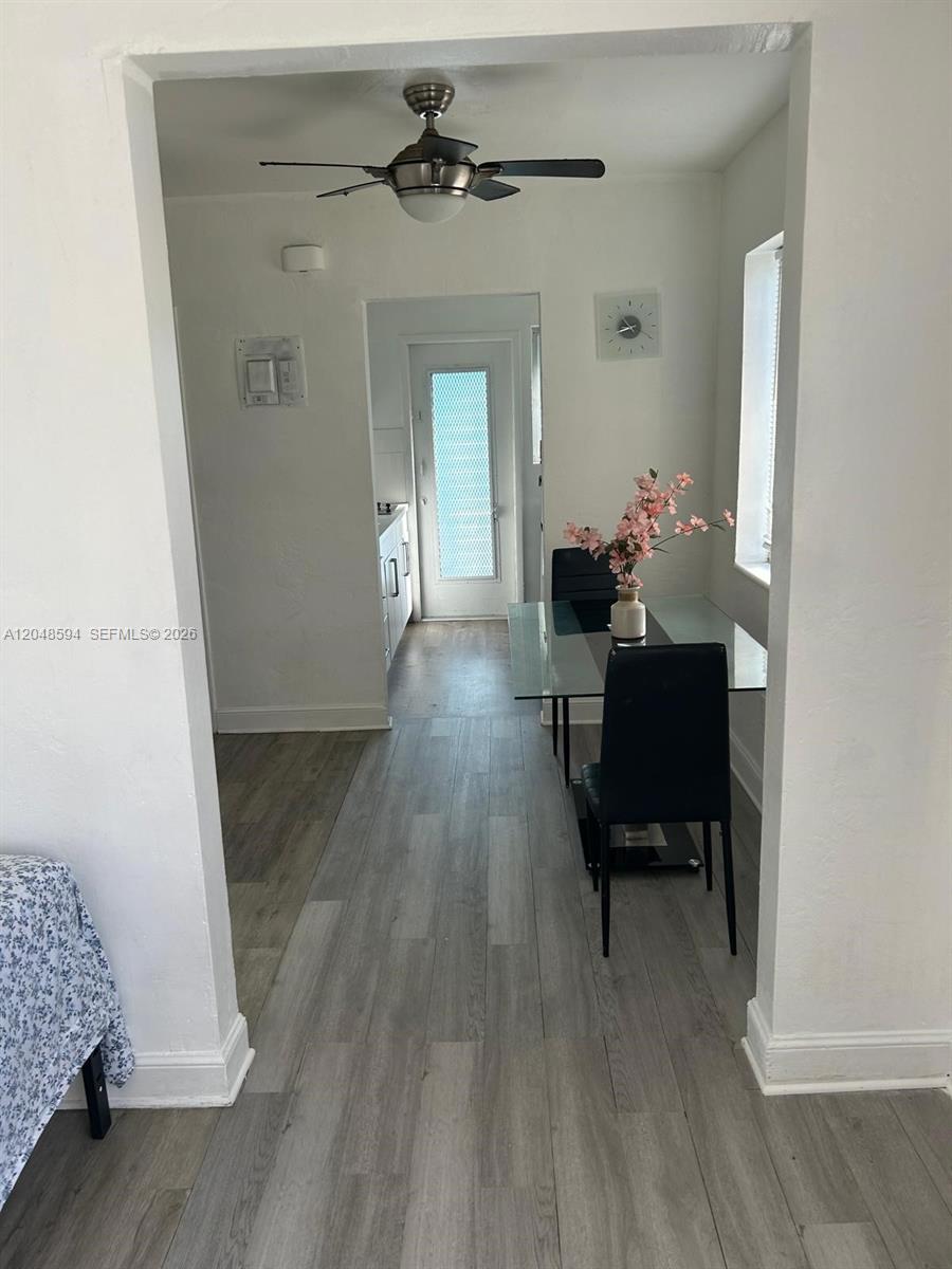 A dining area features a glass table, black chairs, and a ceiling fan — 761 Euclid Ave # 9, Miami Beach FL 33139, MIAMI BEACH, FL