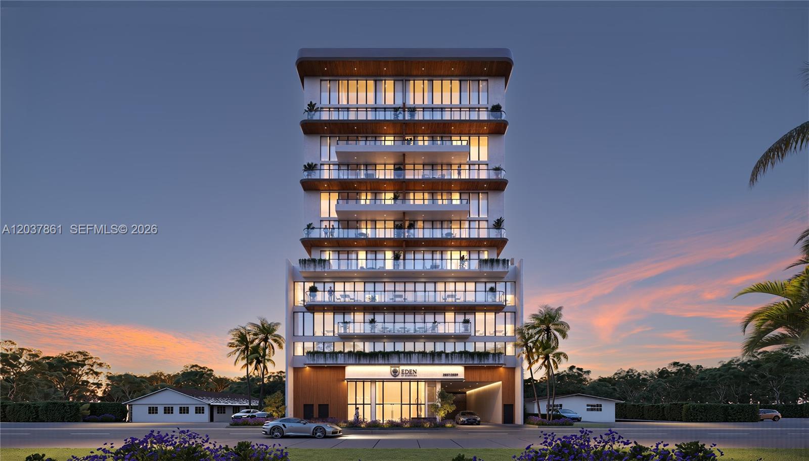 This is a rendering of a modern multi-story residential building at dusk — 2557 NE 190th St # 602, Miami FL 33180, MIAMI, FL