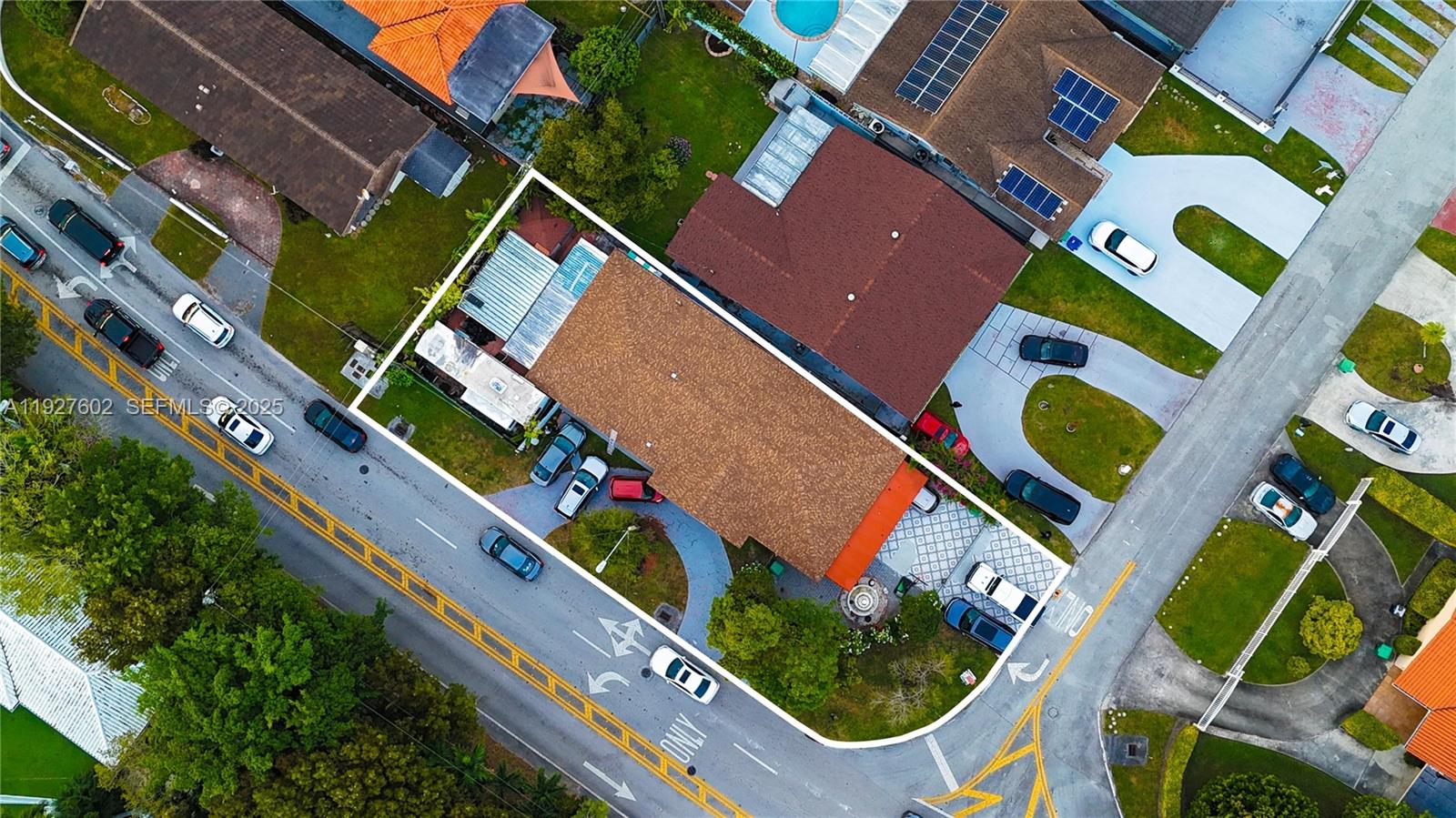 An aerial view shows a residential property with a brown roof and multiple parked cars — 598 SW 121st Ave, Miami FL 33184, MIAMI, FL
