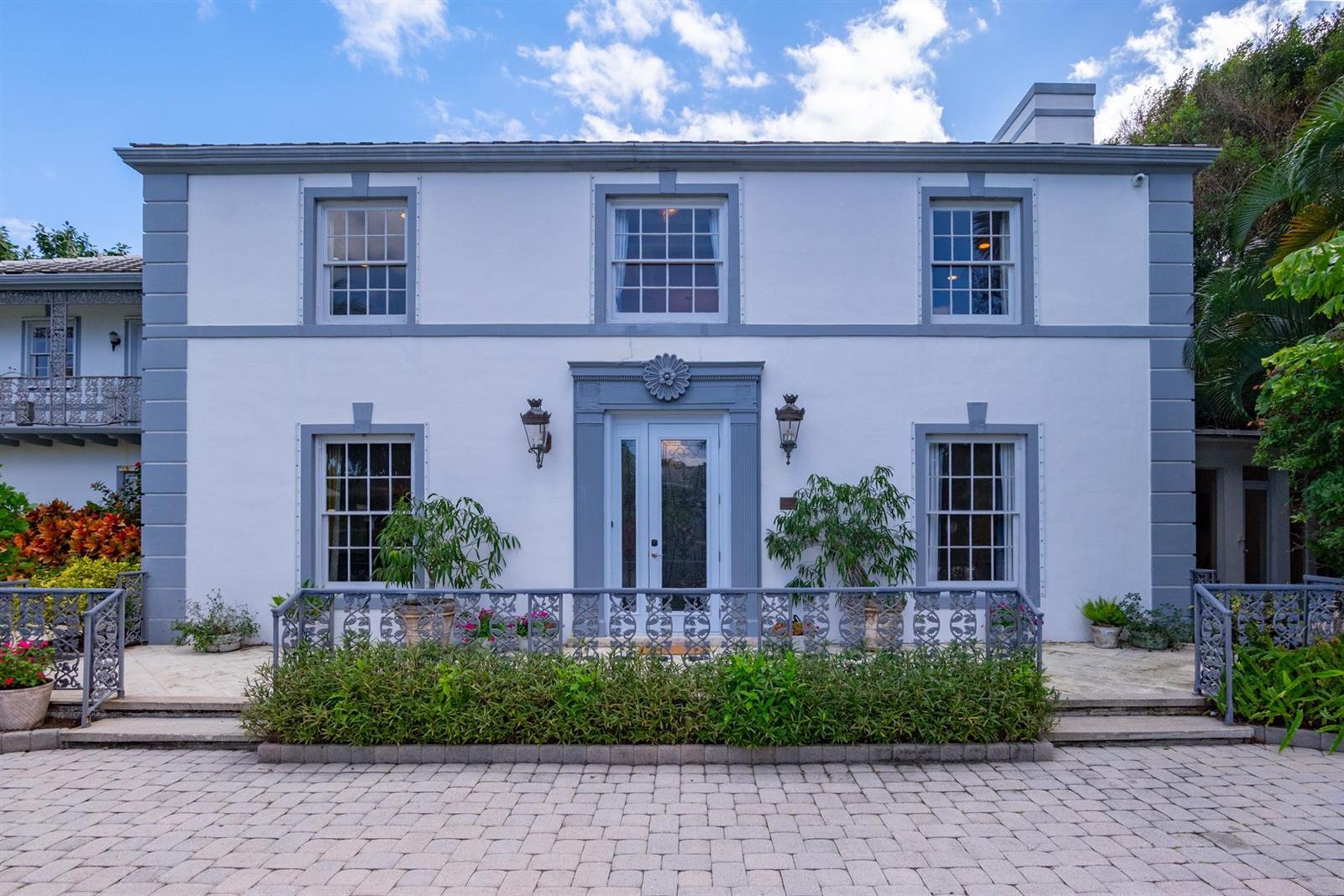 A two-story white house with grey trim, a central entrance, and a paved front courtyard — 361 Crescent Drive, Palm Beach FL 33480, PALM BEACH, FL
