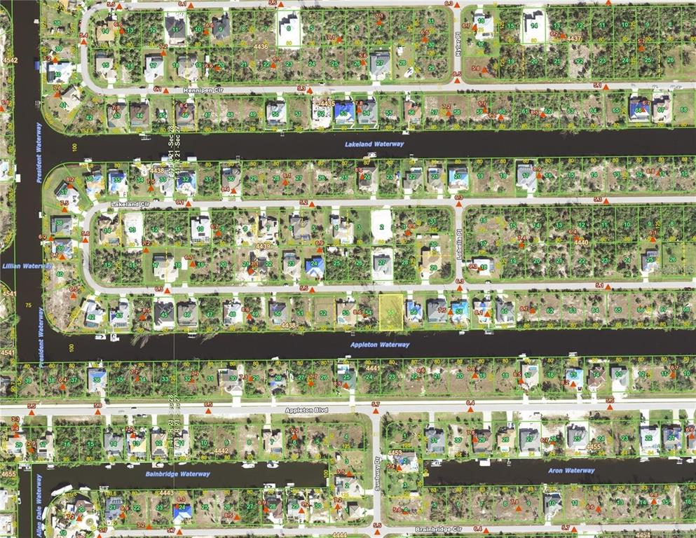 This is a map showing residential lots, streets, and waterways in a suburban neighborhood — 15408 LAKELAND CIRCLE, PORT CHARLOTTE, FL
