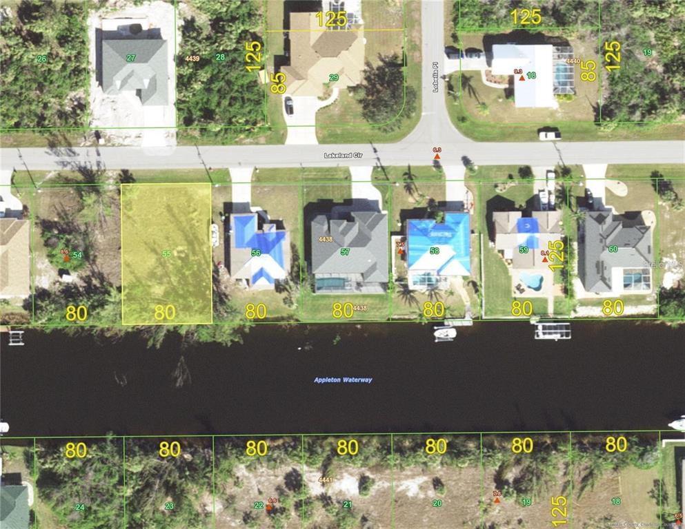 This is an aerial map showing residential lots along a waterway and a street — 15408 LAKELAND CIRCLE, PORT CHARLOTTE, FL