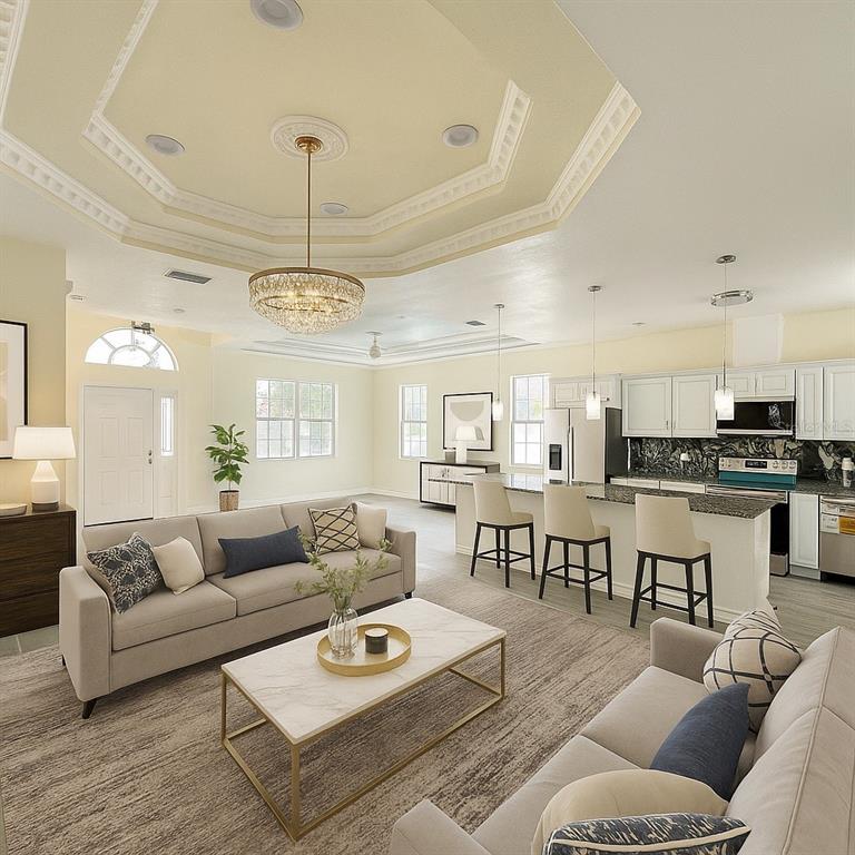 This rendering shows an open-concept living room and kitchen with a tray ceiling and island — 5710 42ND STREET N, ST PETERSBURG, FL