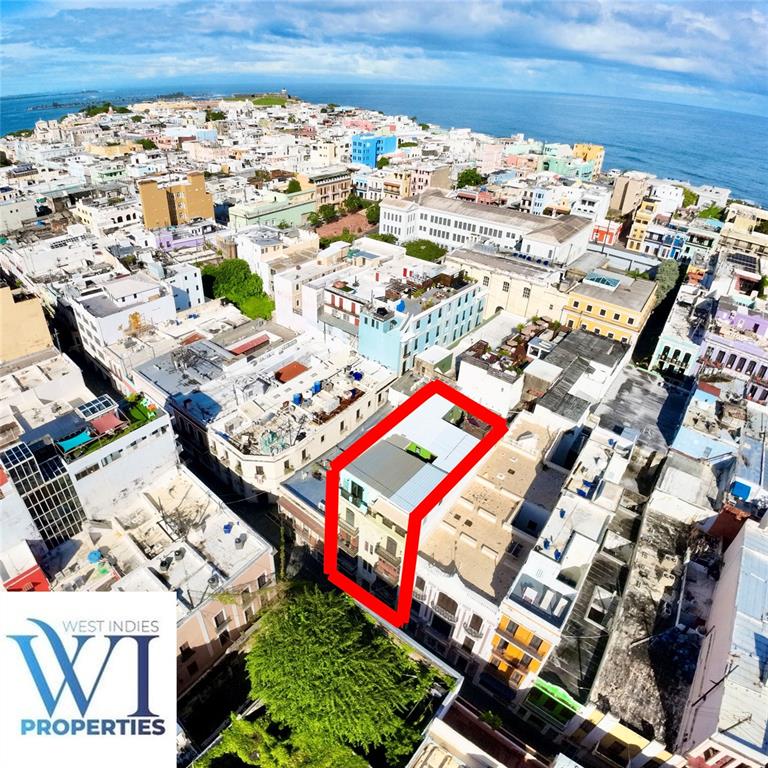An aerial view of a multi-story building highlighted in red within a dense urban area — 351 FORTALEZA UNIT 7, SAN JUAN, PR