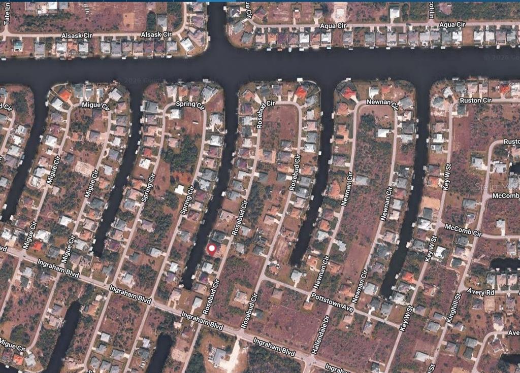 This is an aerial map view of a residential neighborhood with houses along canals — 9214 ROSEBUD CIRCLE, PORT CHARLOTTE, FL