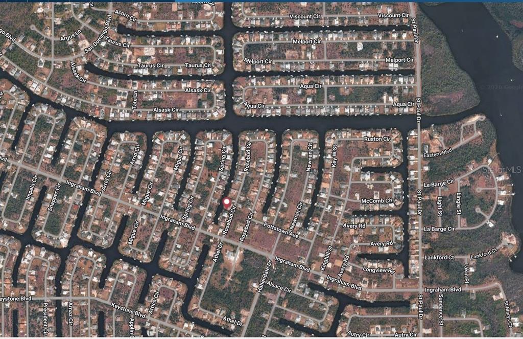 This is an aerial map showing a residential neighborhood with canals and street names — 9214 ROSEBUD CIRCLE, PORT CHARLOTTE, FL