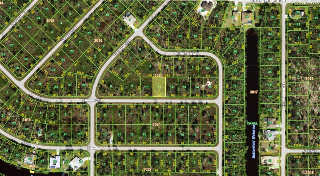 This is a satellite map showing a highlighted residential lot within a suburban neighborhood — 14131 NEVADA AVENUE, PORT CHARLOTTE, FL