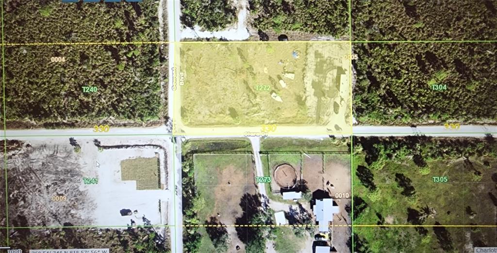 This aerial map shows a highlighted rectangular plot of land at a road intersection — 29290 CLARA DRIVE, PUNTA GORDA, FL