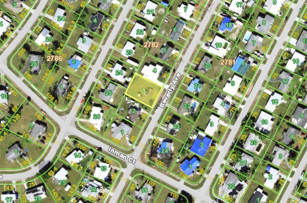 This is an aerial map showing a vacant residential lot highlighted in yellow — 22016 BEVERLY AVENUE, PORT CHARLOTTE, FL