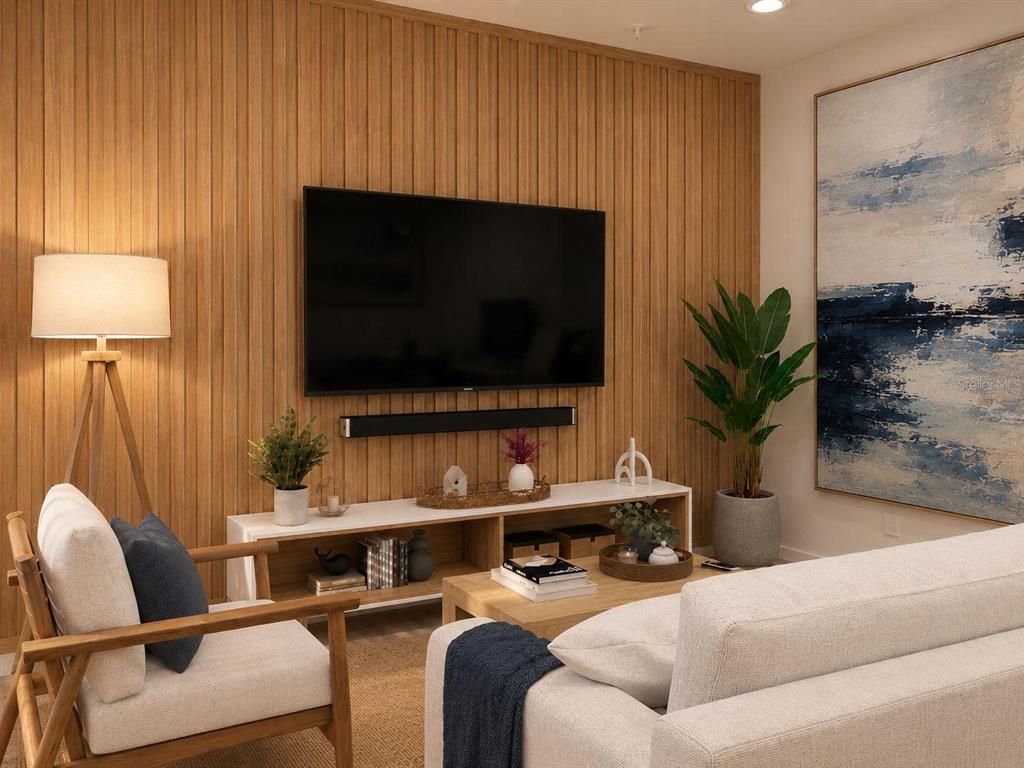 A living room features a wood-slatted accent wall, a wall-mounted television, and modern furniture — 134 TESSIE LANE, SANFORD, FL