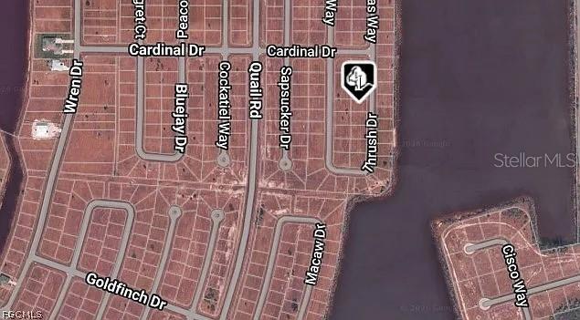 This is an aerial map showing a residential neighborhood with street names and lot layouts — 40 THRUSH DRIVE, PLACIDA, FL