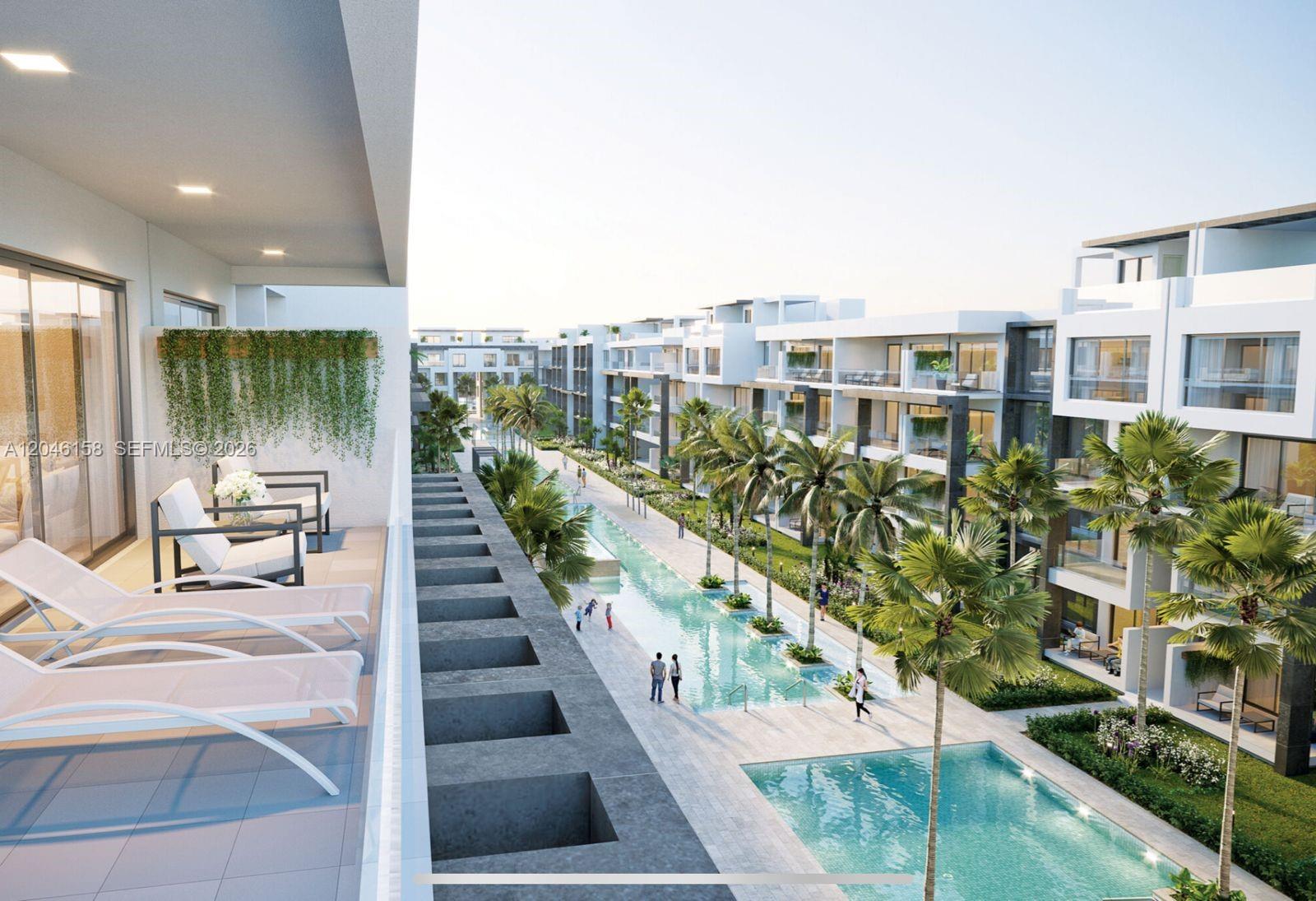 This architectural rendering shows a balcony overlooking a modern apartment complex with a swimming pool — 0 E Avenida Alemania Esq. El Dorado # 3, FL, FL