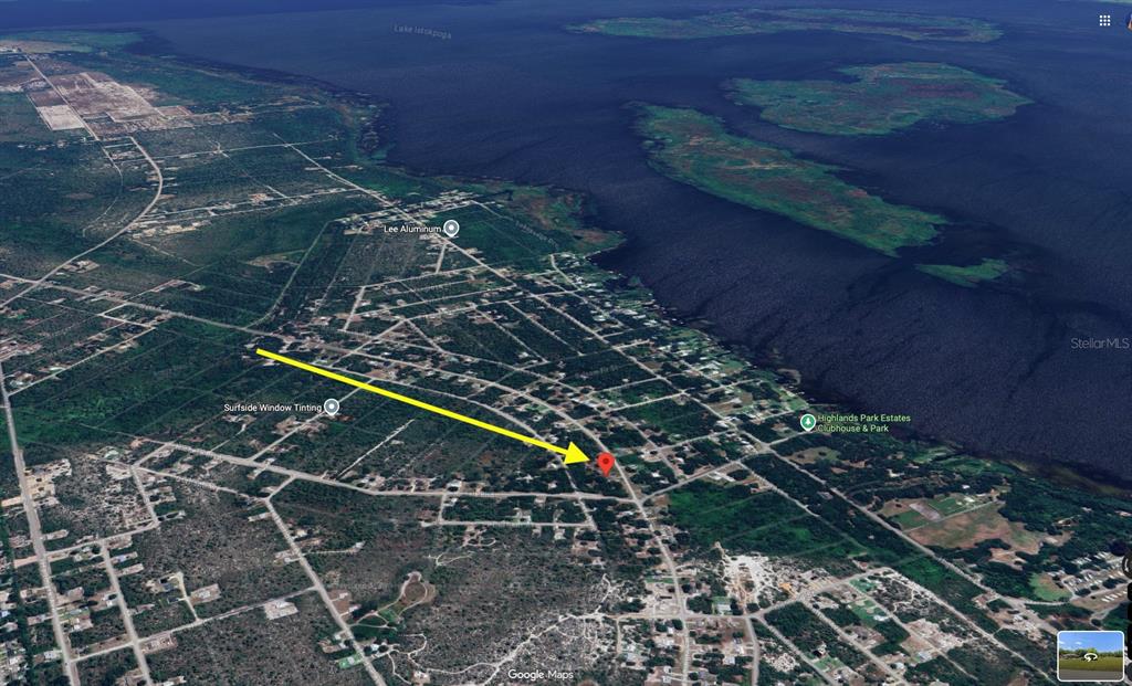 This is an aerial map view showing a residential area near a large lake — 344 WASHINGTON BOULEVARD, LAKE PLACID, FL