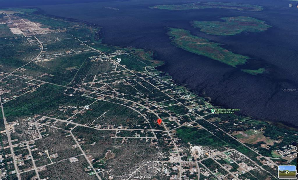 This is an aerial map view of a residential neighborhood near a large lake — 344 WASHINGTON BOULEVARD, LAKE PLACID, FL