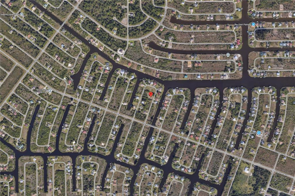 This is an aerial map view of a residential neighborhood with canal-front properties — 9287 SNAPPER CIRCLE, PORT CHARLOTTE, FL