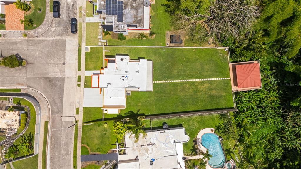 An aerial view shows a house with a large backyard and a detached gazebo — A16 SAN IGNACIO STREET, SAN PEDRO ESTATES, CAGUAS, PR