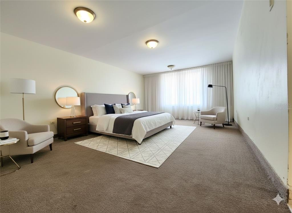 A spacious bedroom features a king-sized bed, two armchairs, and wall-to-wall carpeting — Condado 8-18 C-MANUEL RODRIGUEZ SERRA UNIT 7B, SAN JUAN, PR