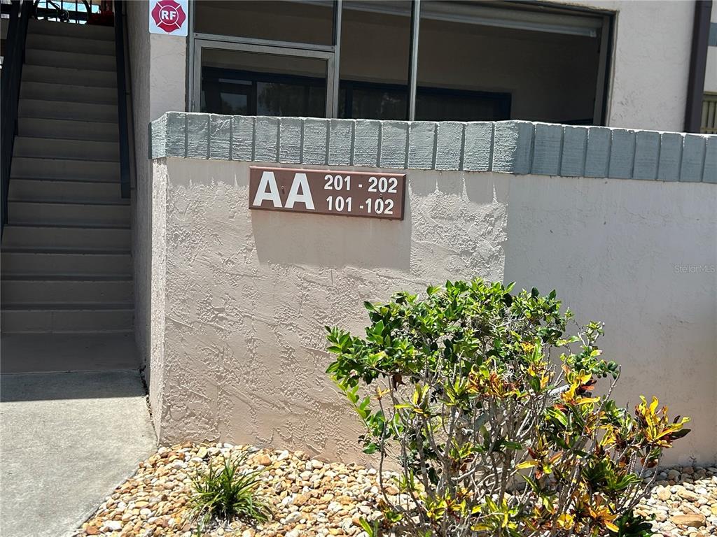 An exterior view of a building labeled AA with unit numbers 101, 102, 201, and 202 — 19505 QUESADA AVENUE UNIT AA201, PORT CHARLOTTE, FL