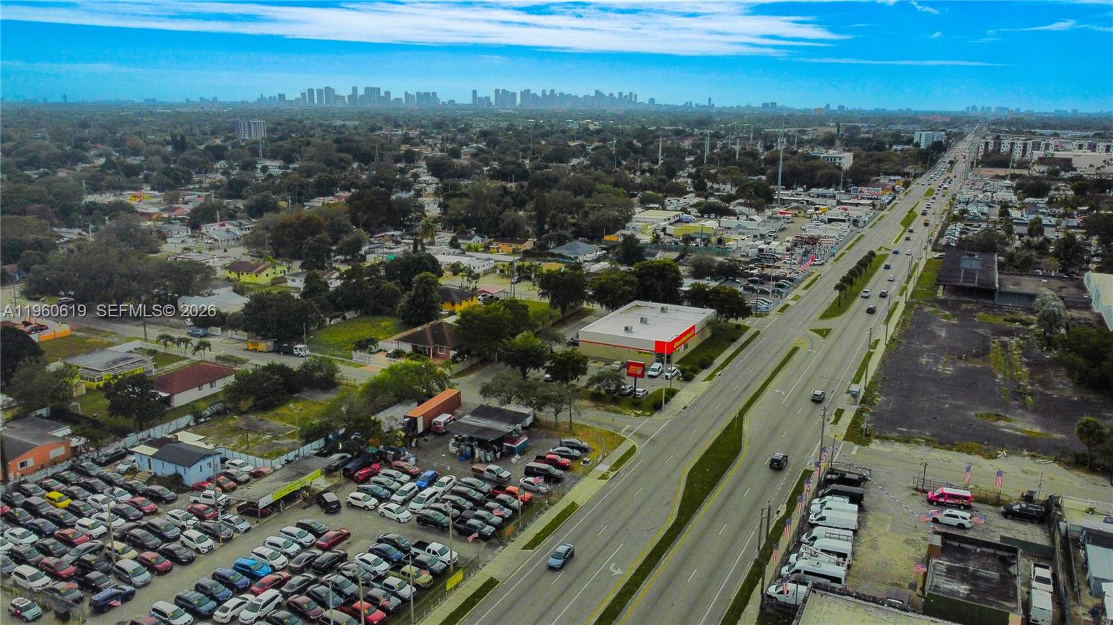 An aerial view shows a commercial area with a car lot and a busy road — 9301 NW 27th Ave, Miami FL 33147, MIAMI, FL