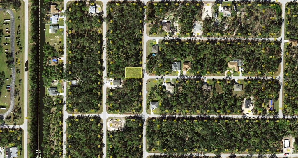 This is an aerial map showing a highlighted vacant residential lot within a wooded neighborhood — 423 STARBORN STREET, PORT CHARLOTTE, FL