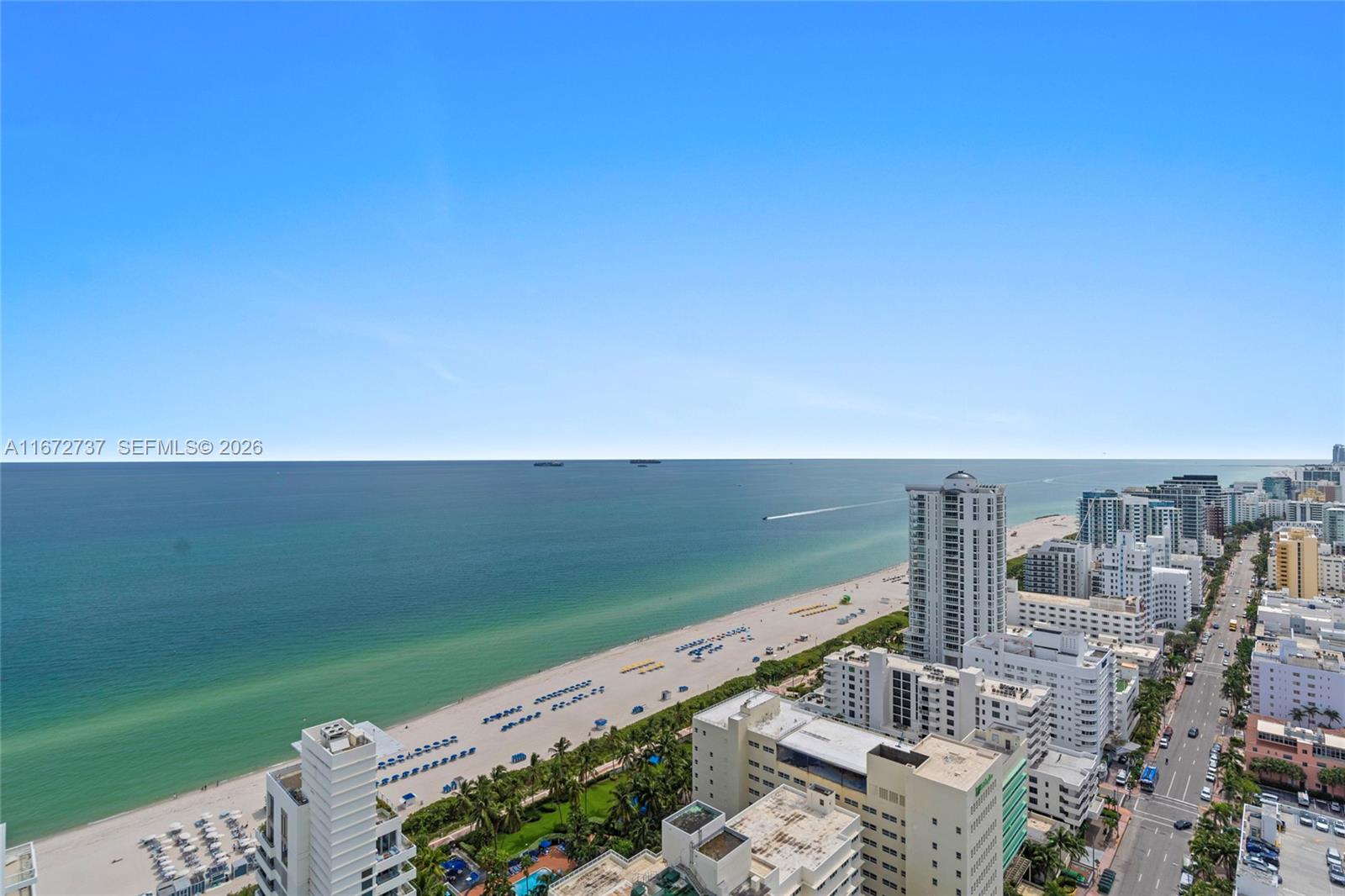 An aerial view shows a sandy beach, the ocean, and a line of coastal buildings — 4401 Collins Ave, Miami Beach FL 33140, MIAMI BEACH, FL