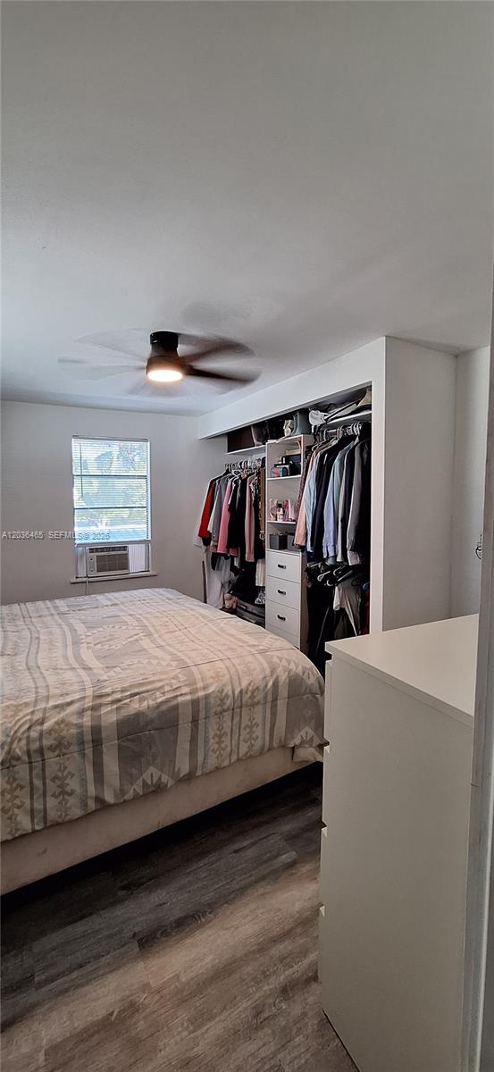 A bedroom features a bed, a ceiling fan, and an open closet with hanging clothes — 4701 SW 73, Davie FL 33314, DAVIE, FL