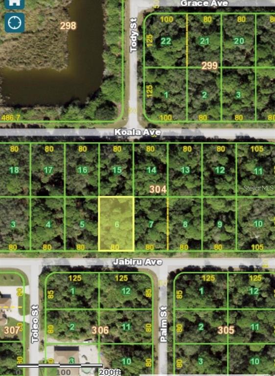 This is a satellite map showing a residential lot highlighted in yellow among surrounding plots — 18052 JABIRU AVENUE, PORT CHARLOTTE, FL