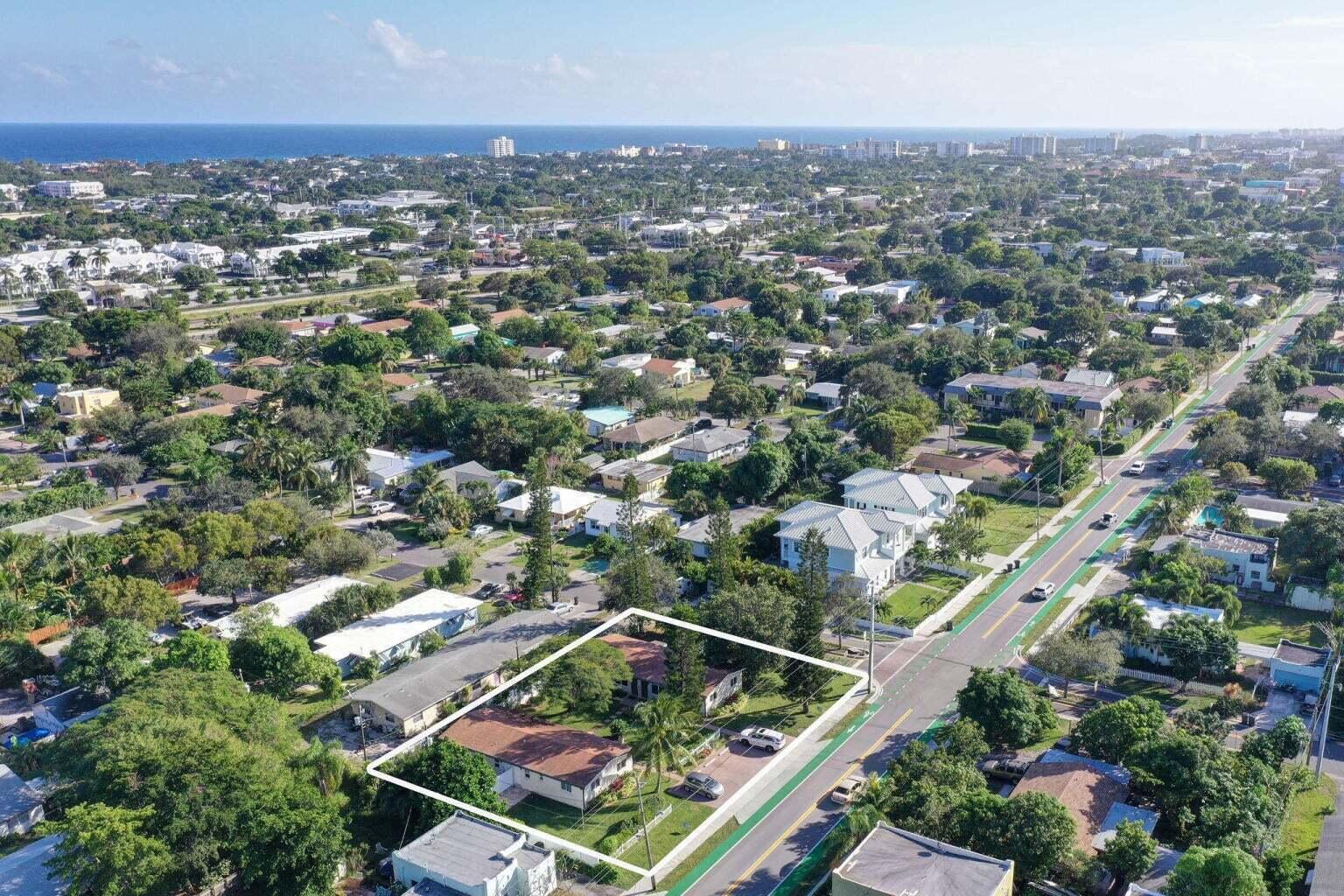 An aerial view shows a single-story house with a large yard along a paved road — 1201 NE 2nd Avenue, Delray Beach FL 33444, DELRAY BEACH, FL