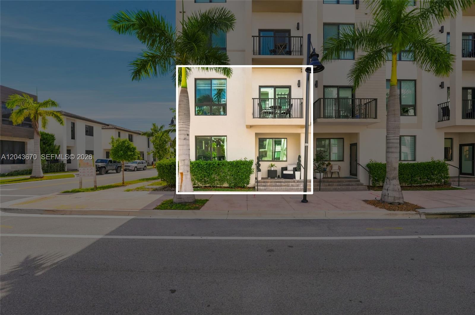 A three-story residential building features a highlighted ground-floor patio and a second-floor balcony — 8167 NW 41st St # 101, Doral FL 33166, DORAL, FL