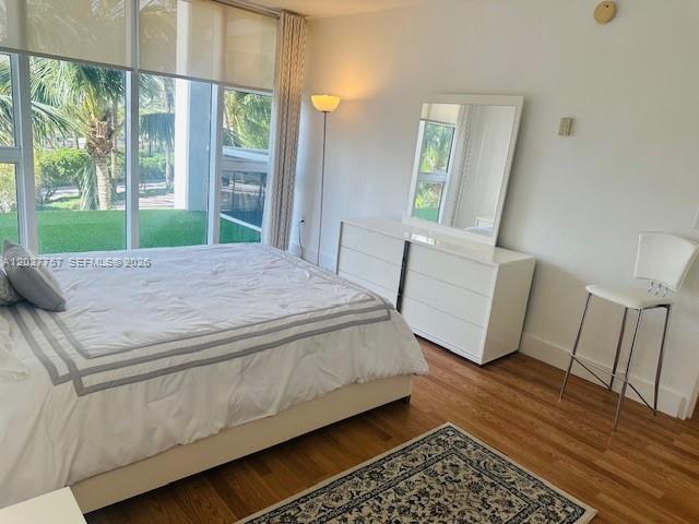 A bedroom features a bed, a white dresser with a mirror, and a tall stool — 10275 Collins Ave # 223, Bal Harbour FL 33154, BAL HARBOUR, FL