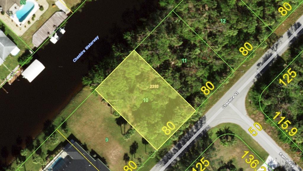 This is an aerial map showing a vacant residential lot highlighted in yellow — 449 CHESHIRE STREET, PORT CHARLOTTE, FL