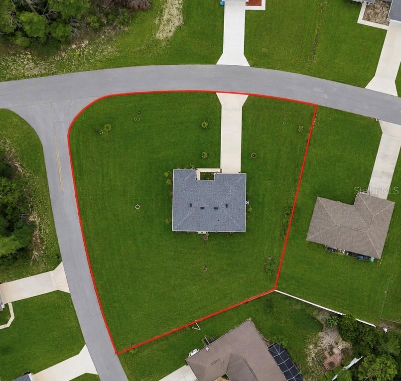 An aerial view shows a house on a large corner lot outlined in red — 15943 SW 53RD COURT, OCALA, FL
