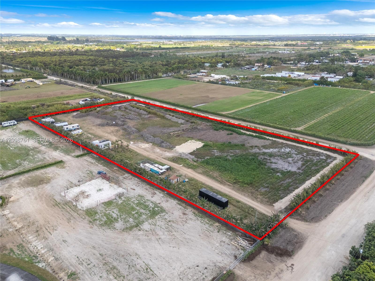 An aerial view shows a large, rectangular plot of land outlined in red — 15202 SW 194th Ave, Miami FL 33196, MIAMI, FL
