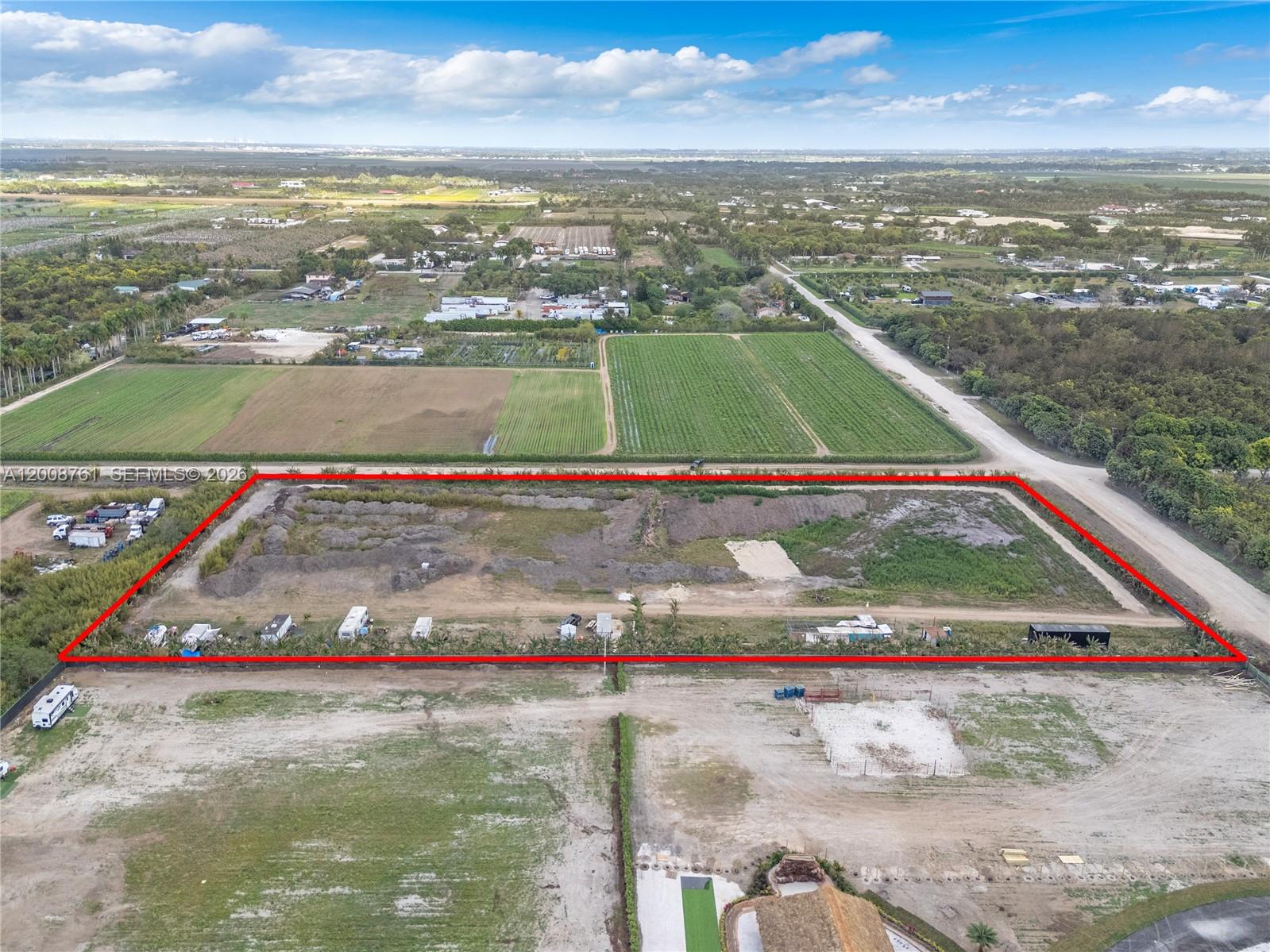 An aerial view shows a rectangular plot of land outlined in red with scattered vehicles — 15202 SW 194th Ave, Miami FL 33196, MIAMI, FL