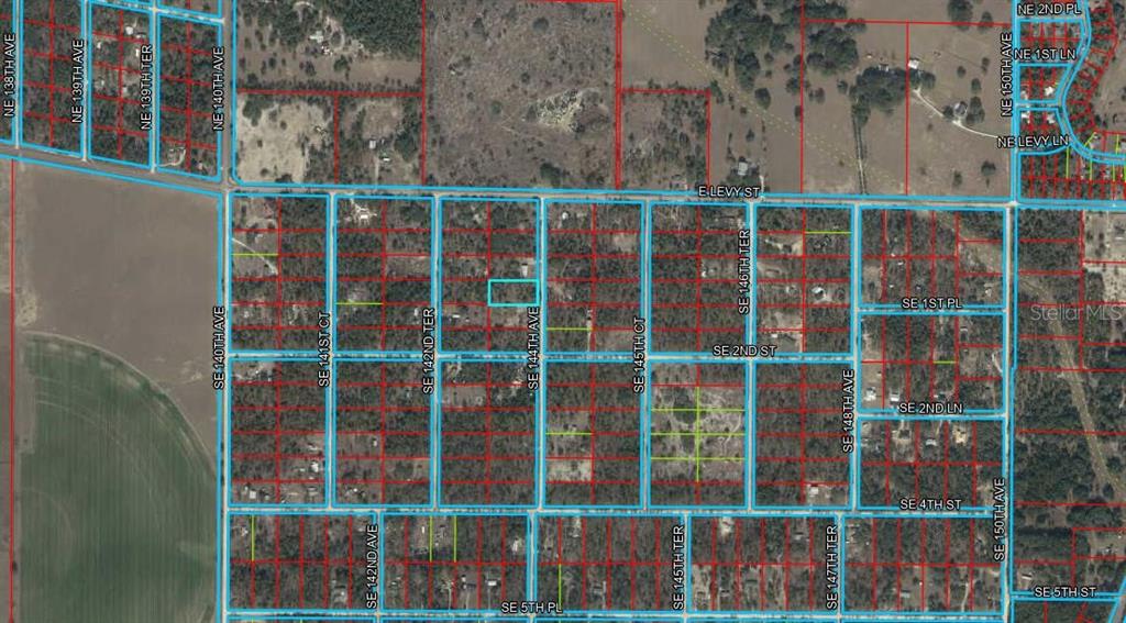 This is an aerial map showing property boundaries overlaid on a wooded residential area — 150 SE 144TH AVENUE, WILLISTON, FL