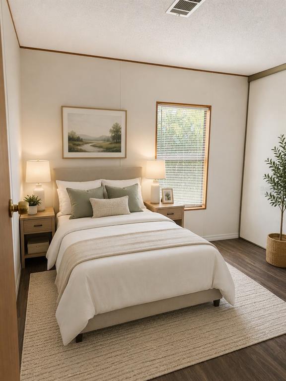 A bedroom features a bed with neutral bedding, two nightstands, and a window with blinds — 1990 CRYSTAL LANE, ST CLOUD, FL