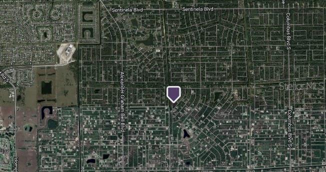 This is a satellite map showing a residential area with a location marker — 323 BUTLER AVENUE S, LEHIGH ACRES, FL