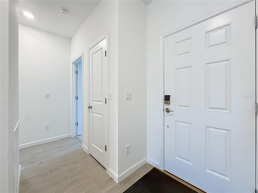 An empty bedroom features white walls, gray carpet, a ceiling fan, and a single window — 3153 TUPELO LOOP, GREEN COVE SPRINGS, FL