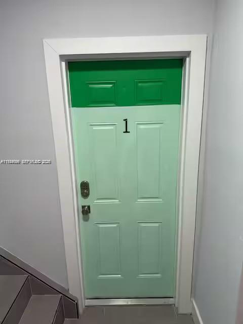A light green door labeled with the number one is set within a white frame — 6828 NW 3rd Ave # 1, Miami FL 33150, MIAMI, FL