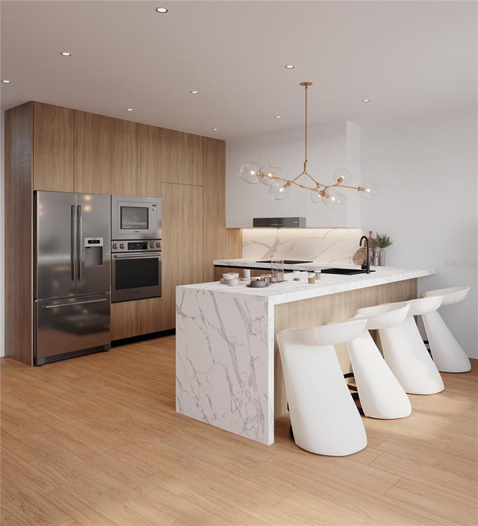 This is a rendering of a modern kitchen featuring a marble waterfall island and cabinetry — 2170 ROBINHOOD STREET UNIT C1-202, SARASOTA, FL