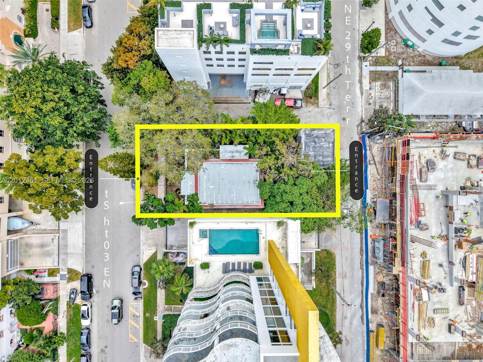 This aerial view shows a rectangular property lot with a house surrounded by trees — 452 NE 30th St, Miami FL 33137, MIAMI, FL