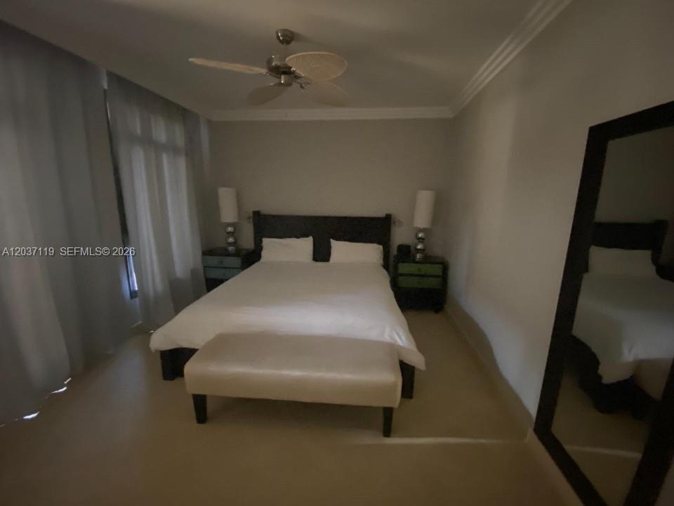 A bedroom features a bed with a dark headboard, a bench, and two nightstands — 0 Fishing lodge # 0, FL, FL