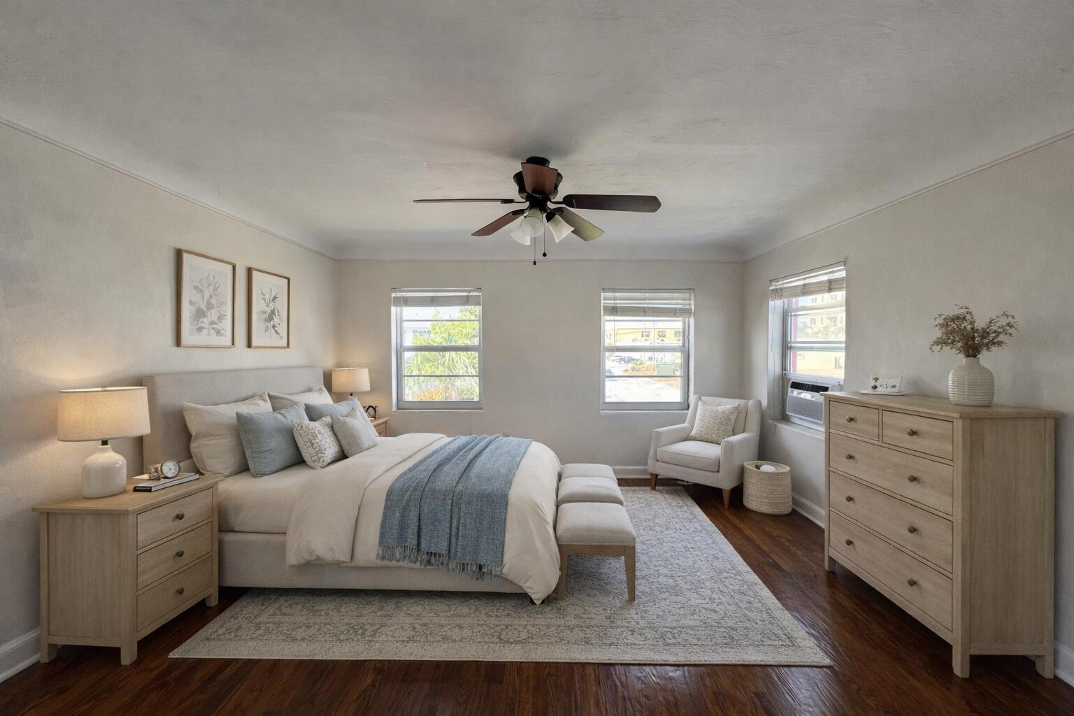 A bedroom features a bed with blue accents, two nightstands, a dresser, and a chair — 14 S M Street # 3, FL 33460, FL