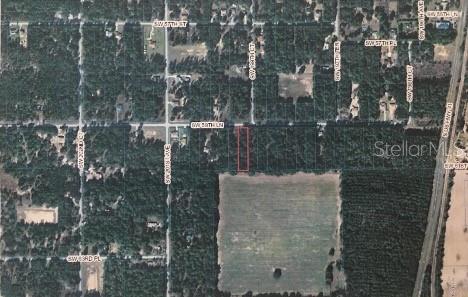 An aerial map view shows a rectangular parcel of land outlined in red — 0 SW 59TH LANE, DUNNELLON, FL