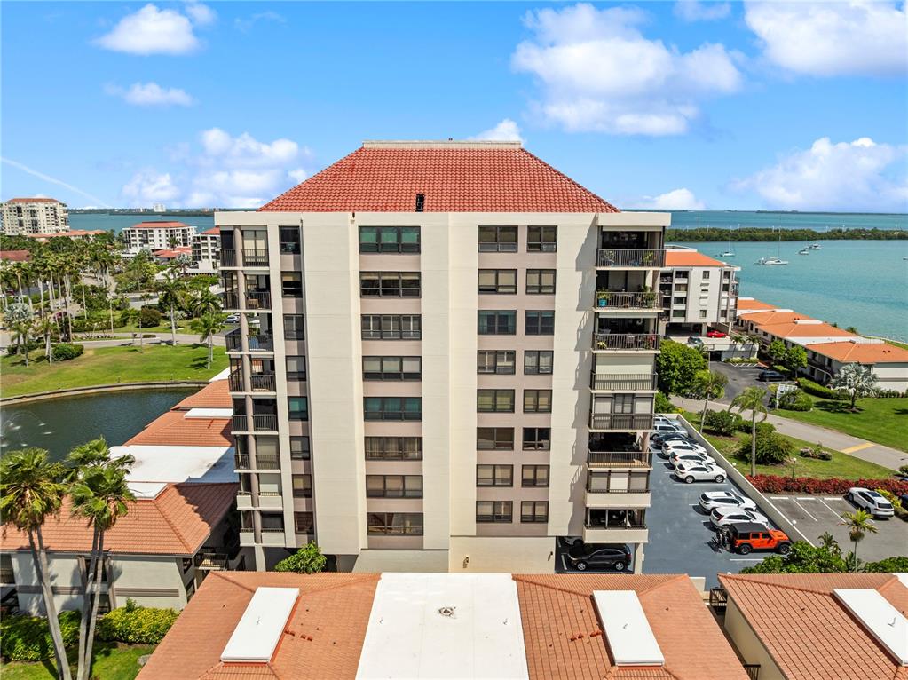 An aerial view shows a multi-story residential building with a red tile roof — 6294 BAHIA DEL MAR CIRCLE UNIT 904, ST PETERSBURG, FL