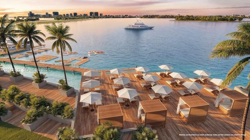 This rendering shows a wooden deck with lounge chairs, umbrellas, and cabanas overlooking the water — NORTH MIAMI, FL