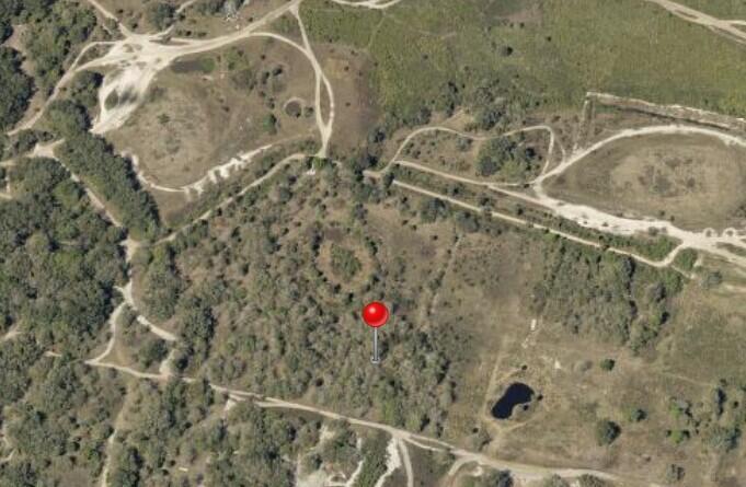 This is an aerial view of a wooded lot with a red location pin — 0 NW 300th Street, Okeechobee FL 34972, OKEECHOBEE, FL