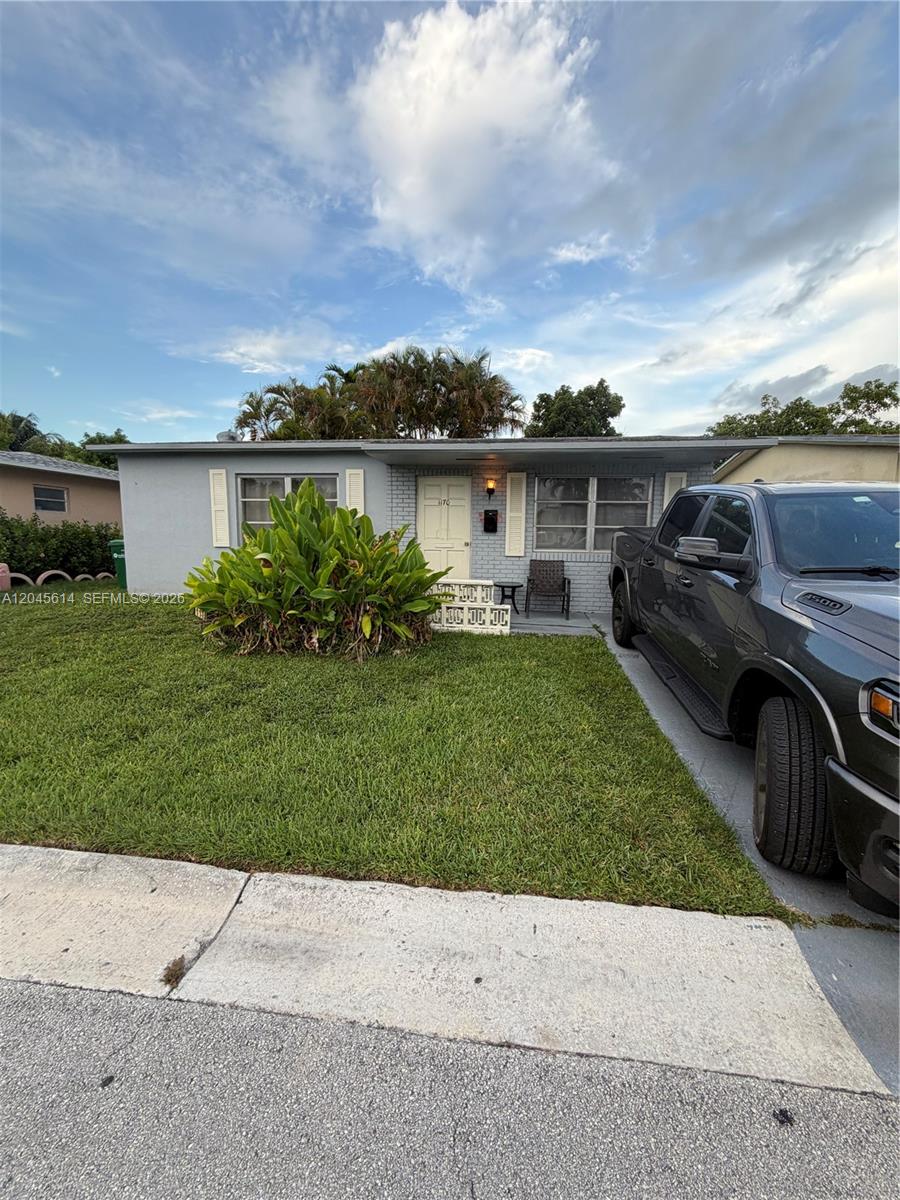 A single-story gray house with a front lawn and a pickup truck parked in the driveway — 1170 NW 66th Ter, Margate FL 33063, MARGATE, FL