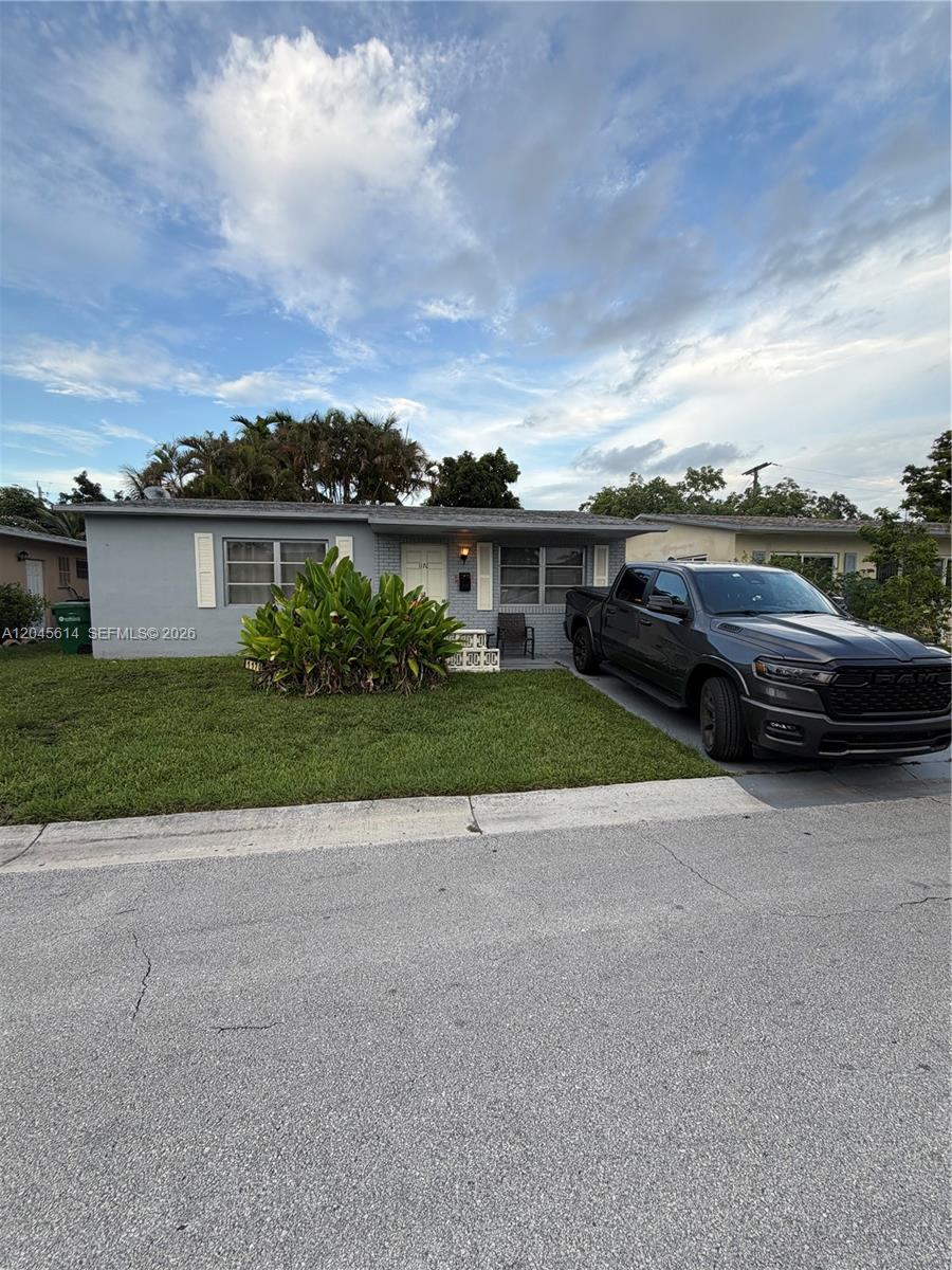 A single-story gray house with a front lawn and a dark pickup truck parked outside — 1170 NW 66th Ter, Margate FL 33063, MARGATE, FL